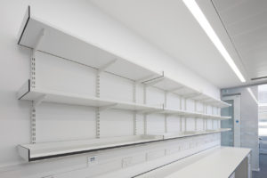 Wall mounted fully adjustable slotted shelving system