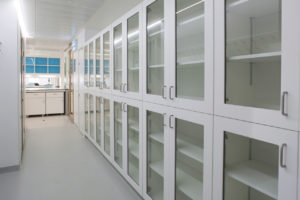 Glass fronted tall storage units.